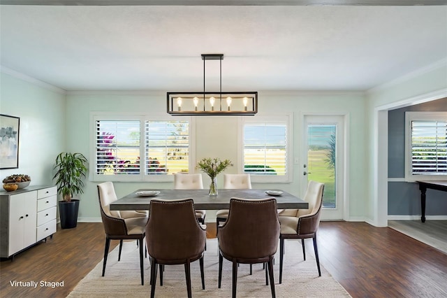 dining room featuring dark hardwood / wood-style flooring, ornamental molding, and a notable chandelier