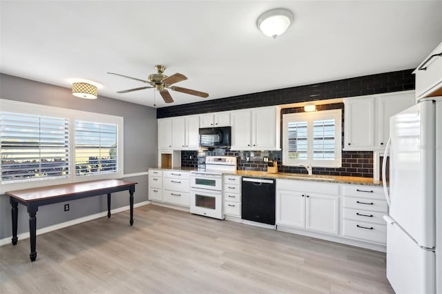 kitchen featuring white cabinetry, sink, ceiling fan, decorative backsplash, and black appliances