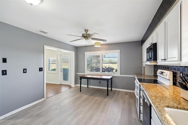 kitchen featuring ceiling fan, tasteful backsplash, light hardwood / wood-style floors, electric stove, and white cabinets