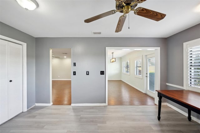 interior space featuring light hardwood / wood-style flooring and ceiling fan