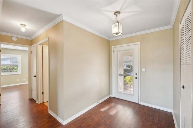 entrance foyer with dark hardwood / wood-style flooring and ornamental molding