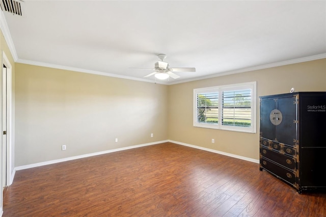 unfurnished bedroom featuring dark hardwood / wood-style floors, ceiling fan, and crown molding