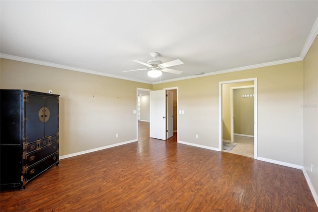 unfurnished bedroom featuring ceiling fan, dark wood-type flooring, and ornamental molding