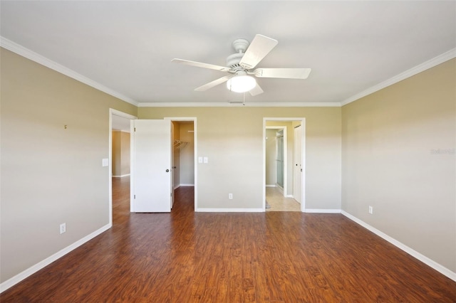 unfurnished room featuring ceiling fan, dark wood-type flooring, and ornamental molding