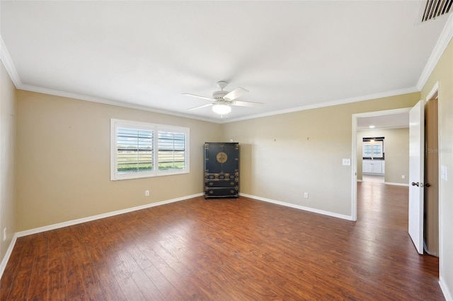 empty room with dark wood-type flooring, ceiling fan, and ornamental molding