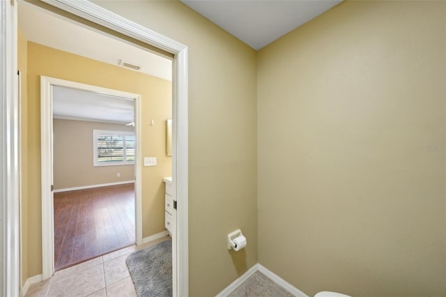 bathroom with tile patterned flooring and vanity