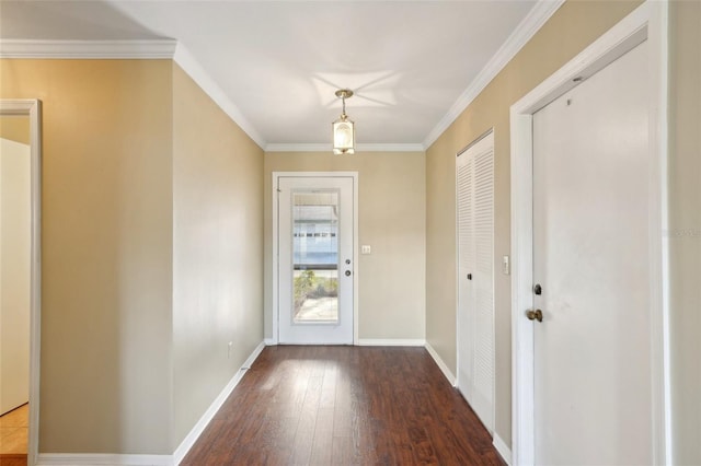 doorway with crown molding and hardwood / wood-style floors