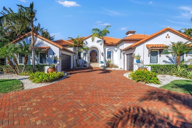 mediterranean / spanish-style house featuring a garage