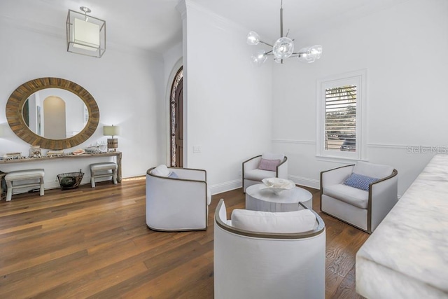 living area with a chandelier and dark wood-type flooring