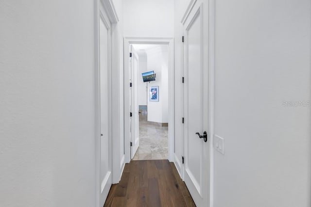 hall with hardwood / wood-style floors