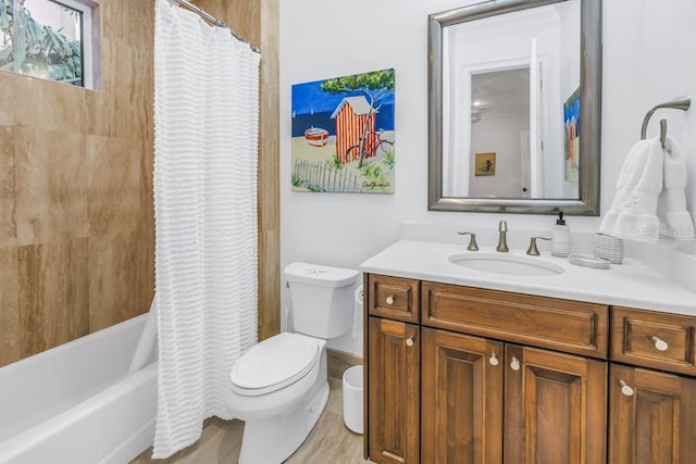 full bathroom featuring shower / bathtub combination with curtain, vanity, wood-type flooring, and toilet