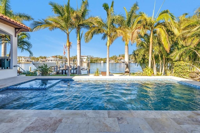 view of swimming pool featuring a boat dock and a water view