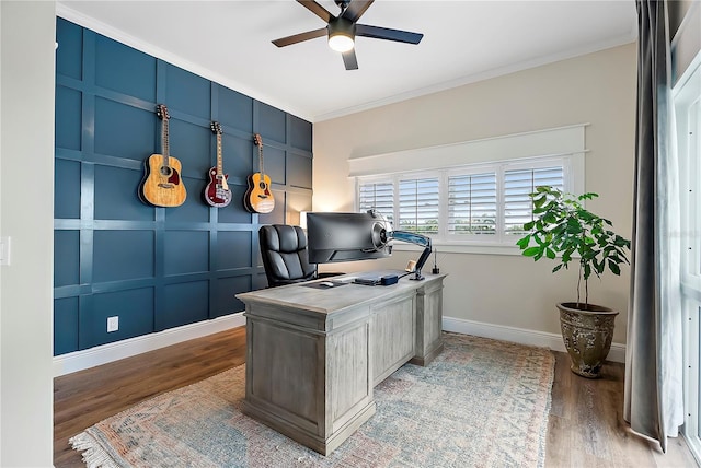 office area with ceiling fan, wood-type flooring, and ornamental molding