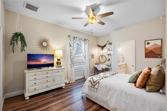 bedroom with ceiling fan, dark hardwood / wood-style flooring, and ensuite bath