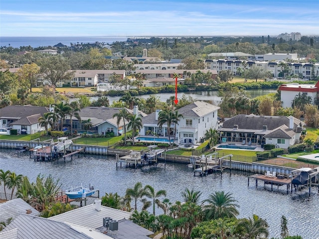 birds eye view of property featuring a water view