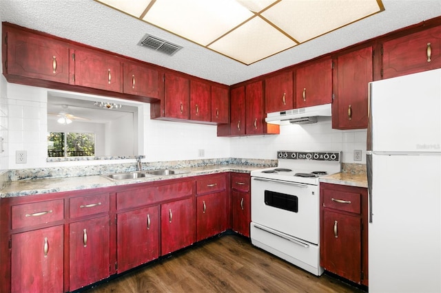 kitchen featuring ceiling fan, dark hardwood / wood-style flooring, white appliances, and sink