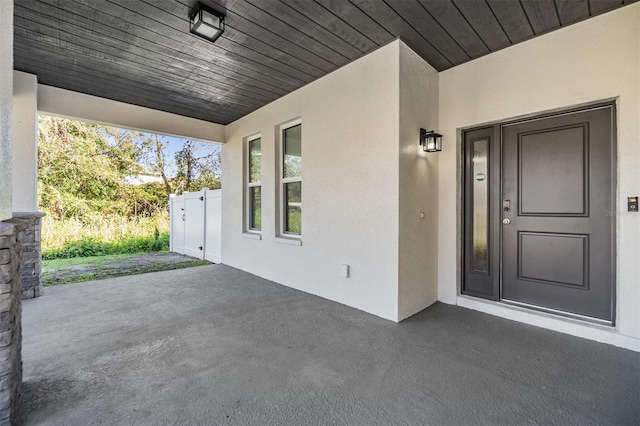 doorway to property with a porch