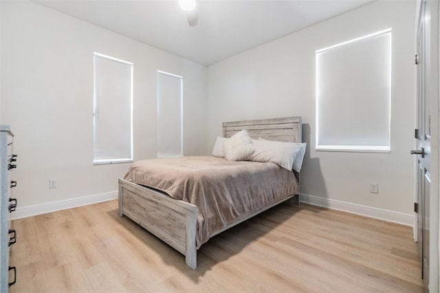 bedroom featuring ceiling fan and light hardwood / wood-style floors