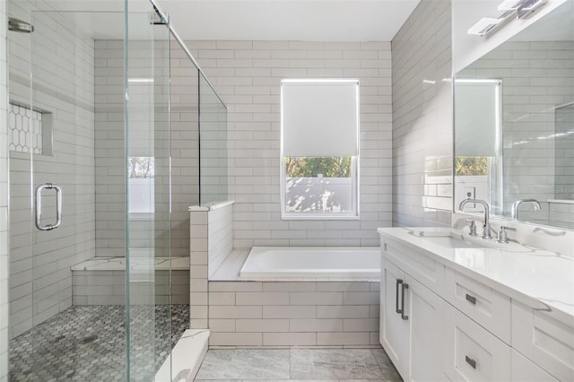 bathroom featuring tile patterned floors, vanity, and plus walk in shower