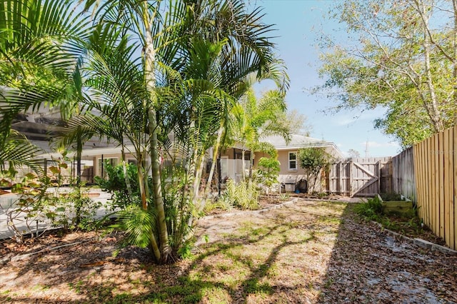 view of yard featuring a gate and fence