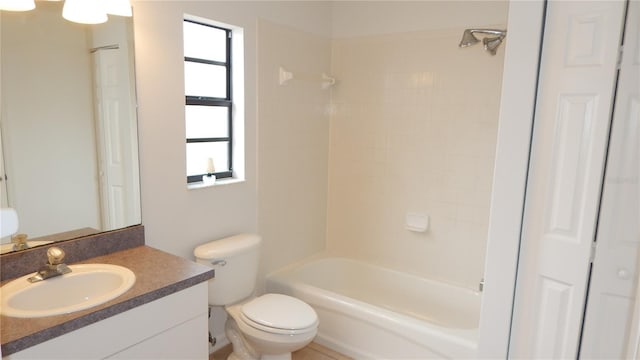 full bathroom with vanity, toilet, and tiled shower / bath