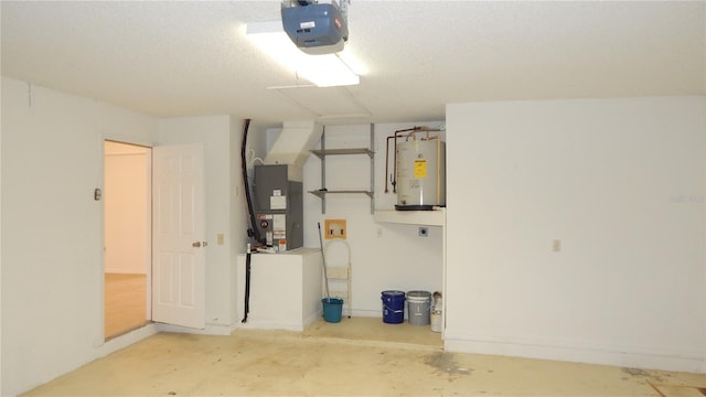 garage featuring heating unit, water heater, and a garage door opener