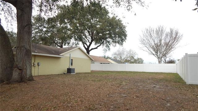 view of yard featuring central air condition unit