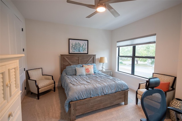 bedroom featuring ceiling fan and light colored carpet