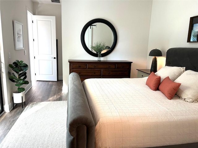 bedroom featuring dark hardwood / wood-style flooring