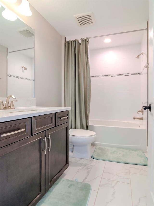 full bathroom with shower / bath combo with shower curtain, vanity, and toilet