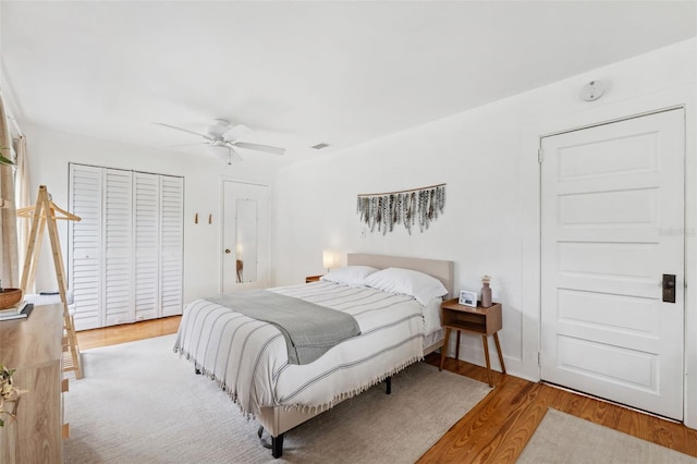 bedroom with light wood-type flooring and ceiling fan