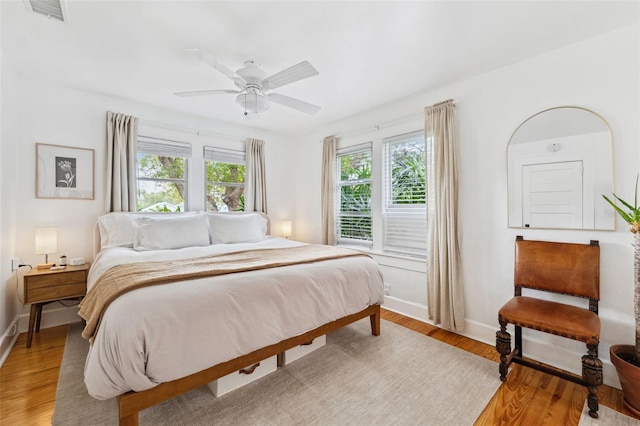 bedroom featuring ceiling fan and light hardwood / wood-style flooring