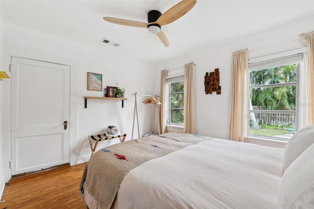 bedroom featuring light hardwood / wood-style floors and ceiling fan