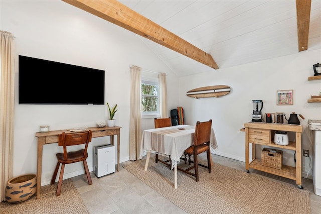 office space with vaulted ceiling with beams