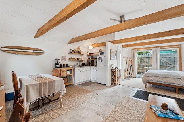 interior space featuring beam ceiling and ceiling fan