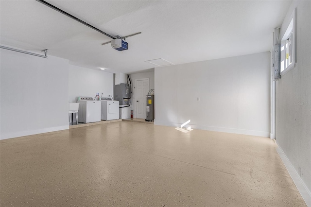 garage with separate washer and dryer, a garage door opener, and water heater