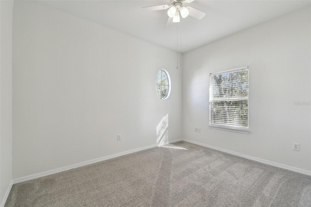 carpeted empty room with ceiling fan