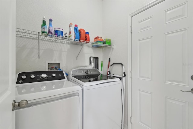 laundry area with independent washer and dryer