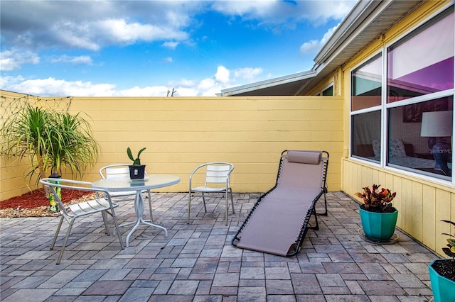 view of patio / terrace featuring outdoor dining space and a fenced backyard