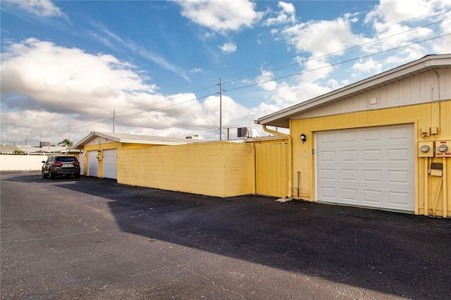 view of side of property featuring an outbuilding