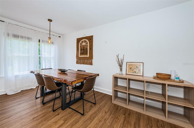 dining area with hardwood / wood-style flooring