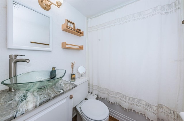 bathroom with vanity and toilet