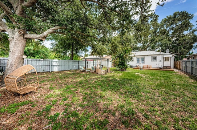 view of yard featuring a wooden deck