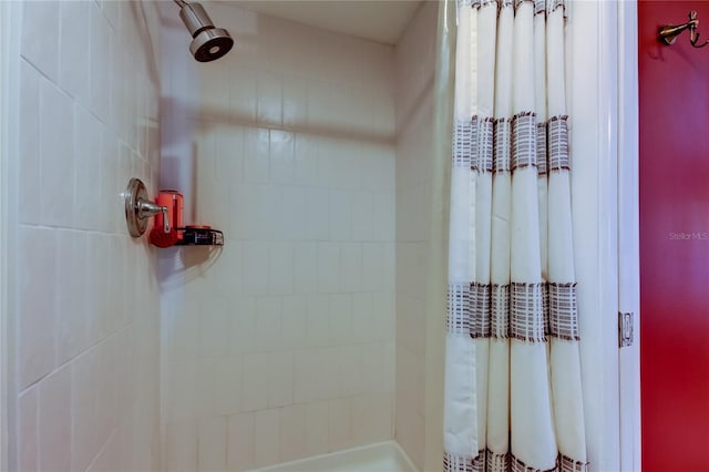 bathroom with a shower with shower curtain