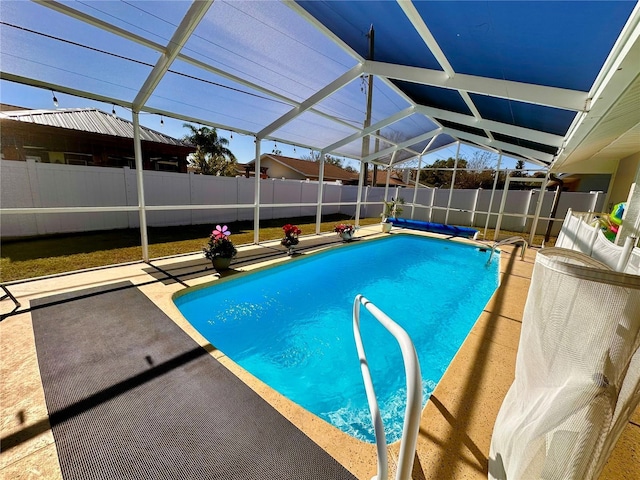 view of pool featuring a fenced in pool, a patio area, a fenced backyard, and a lanai