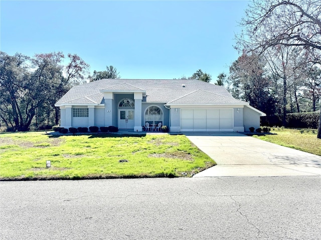 ranch-style home featuring a garage and a front yard