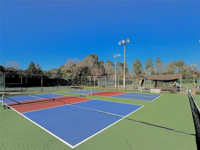 view of sport court featuring community basketball court and fence