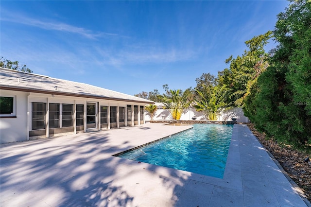 view of swimming pool with a patio