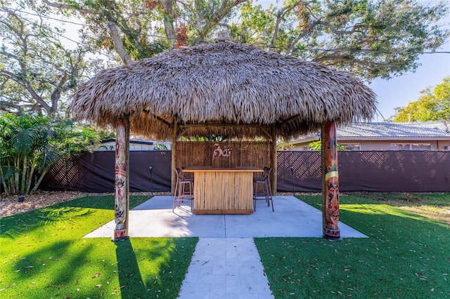 exterior space with a gazebo, an outdoor bar, and a patio area