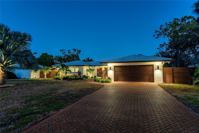 view of front of property with a garage